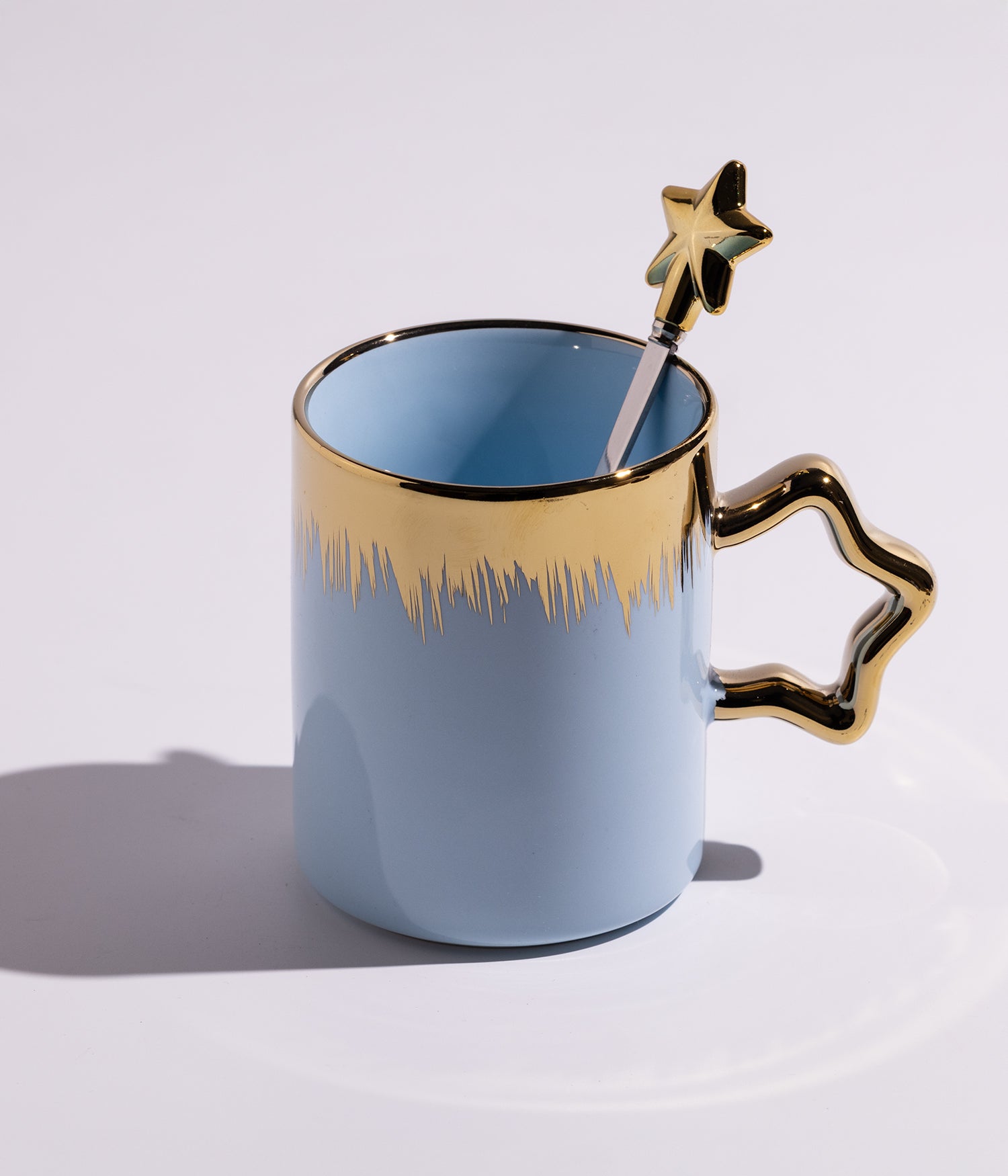 كوب سيراميك بخطوط ذهبيةمع ملعقة على شكل نجمة