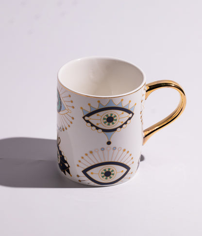 كوب سيراميك بتصميم عيون زرقاء ومقبض ذهبي