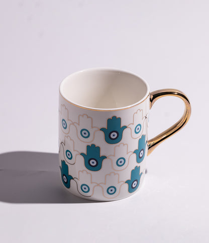 كوب سيراميك بتصميم عيون زرقاء ومقبض ذهبي