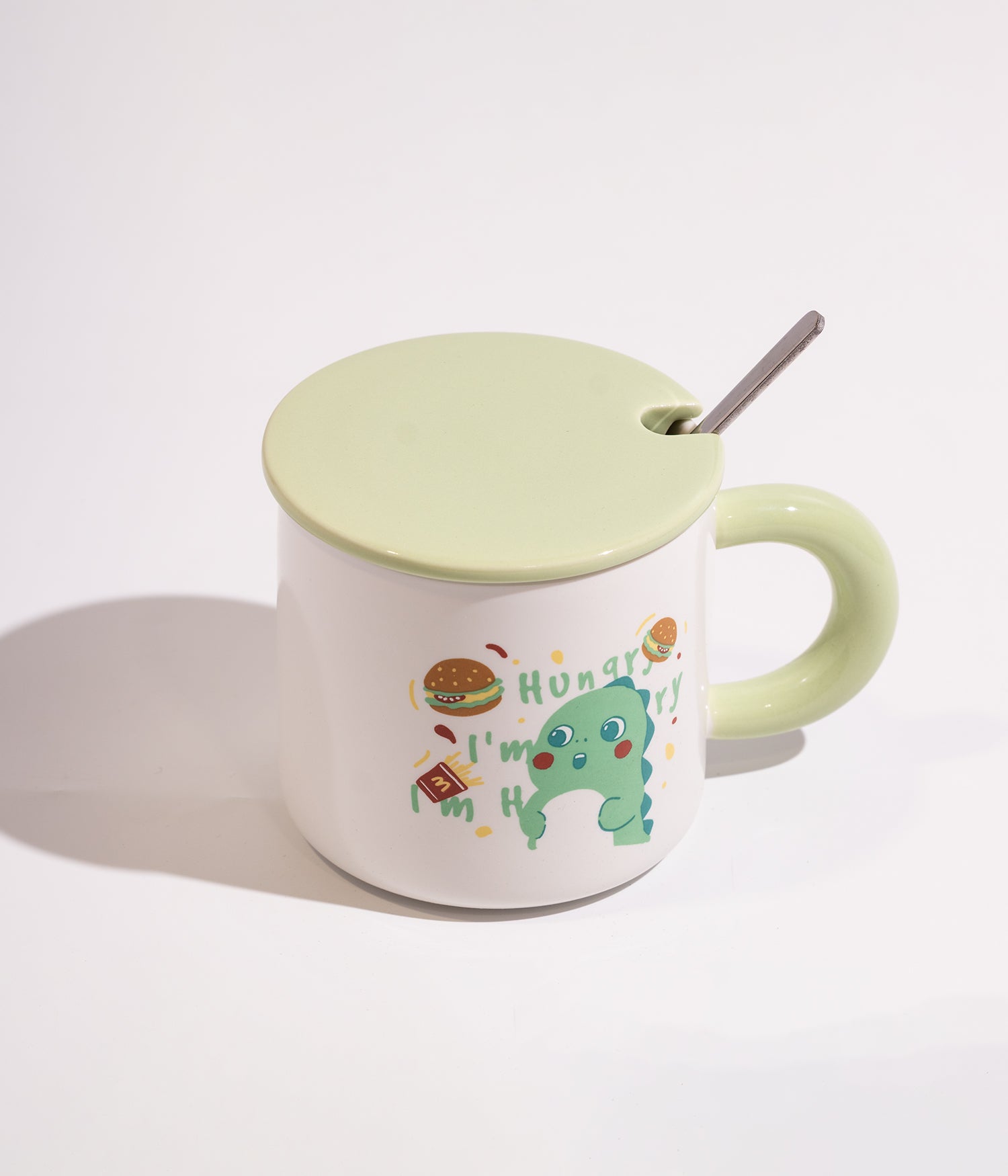 كوب قهوة سيراميك ابيض بتصميم ديناصور مرح مزود بغطاء اخضر وملعقة
