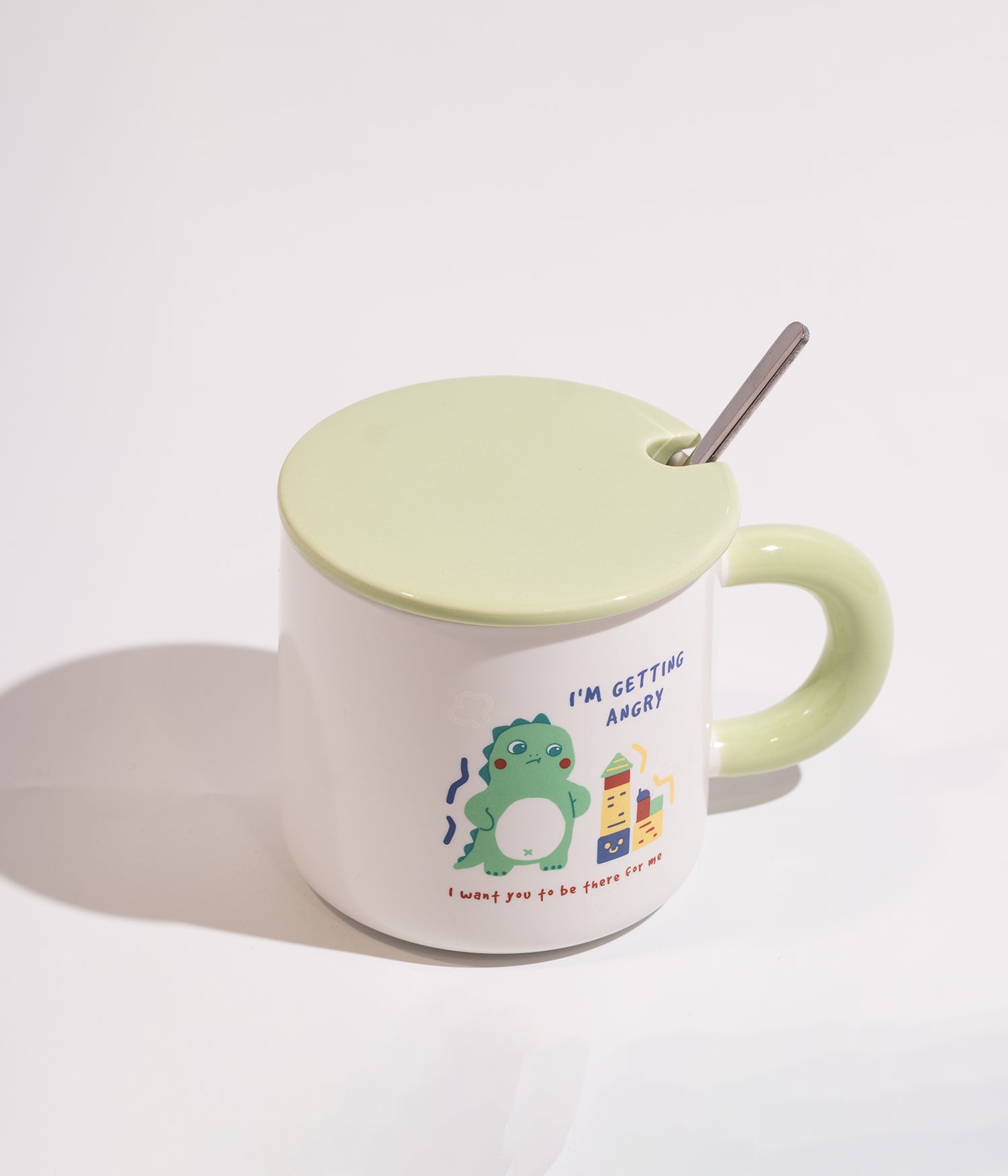 كوب قهوة سيراميك ابيض بتصميم ديناصور مرح مزود بغطاء اخضر وملعقة