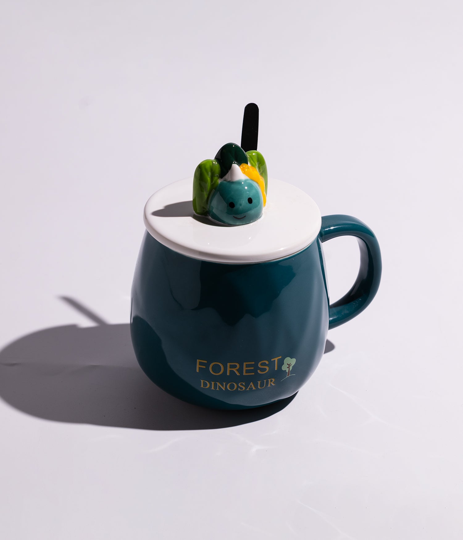 كوب سيراميك بعبارات لطيفة مزوّد بغطاء بمجسم ديناصور وملعقة