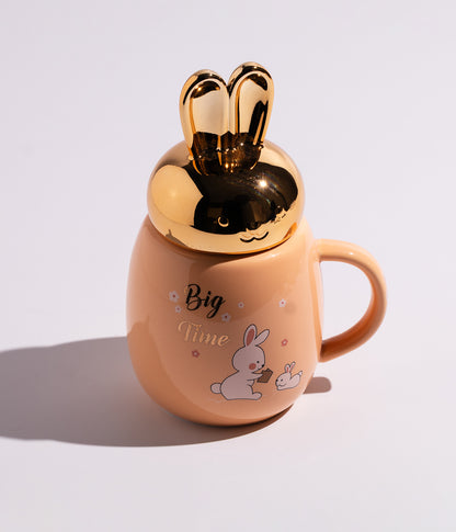 كوب برتقالي مع غطاء أرنب ذهبي